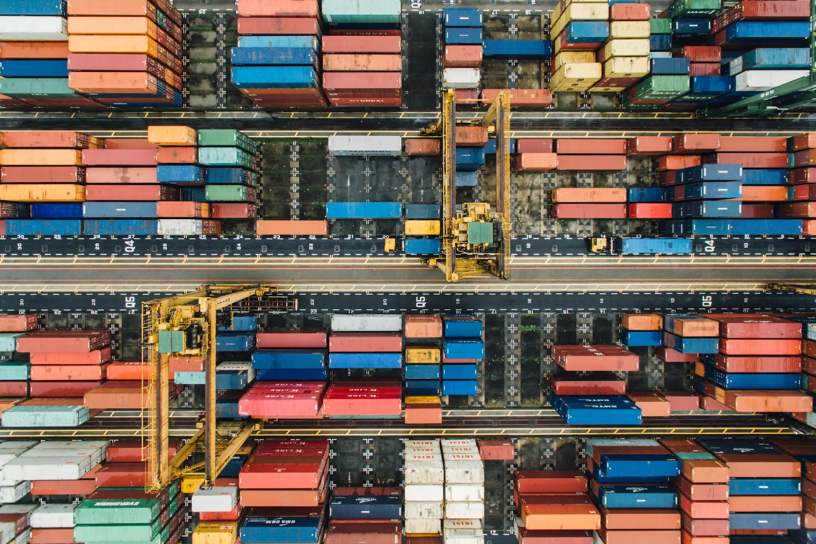 Stacks of shipping containers in a terminal, seen from above